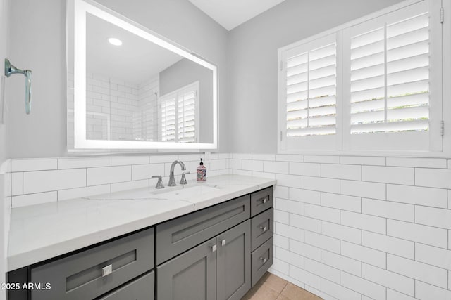 1208 E Tuckey Ln, Phoenix, AZ 85014 - bathroom with vanity, tile patterned flooring, and tile walls