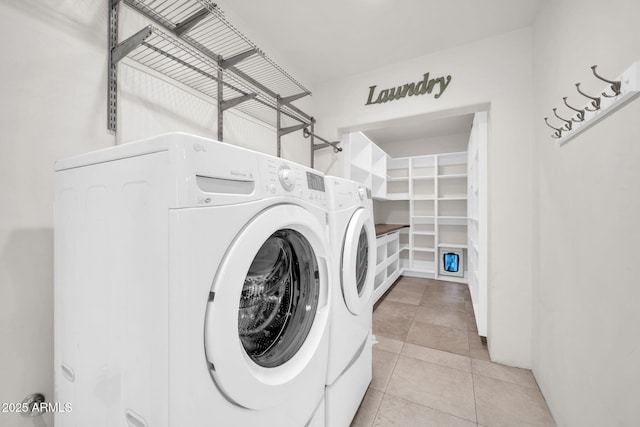 1208 E Tuckey Ln, Phoenix, AZ 85014 - laundry area with washing machine and clothes dryer and tile patterned flooring
