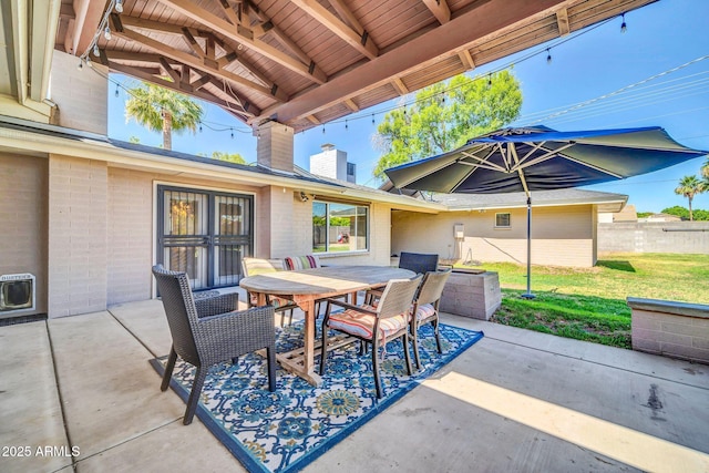 1208 E Tuckey Ln, Phoenix, AZ 85014 - view of patio featuring outdoor dining area and heating unit