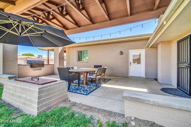 1208 E Tuckey Ln, Phoenix, AZ 85014 - view of patio / terrace featuring a grill and outdoor dining area