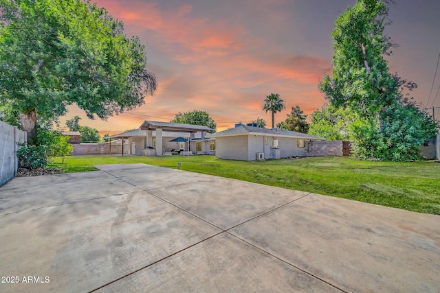 1208 E Tuckey Ln, Phoenix, AZ 85014 - view of front of home featuring a fenced backyard and a patio area
