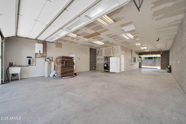 1208 E Tuckey Ln, Phoenix, AZ 85014 - garage with freestanding refrigerator and a sink