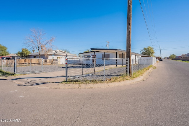 view of front of home featuring fence