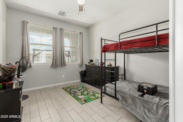 12357 W Whyman Ave, Avondale, AZ 85323 - bedroom featuring wood finished floors, baseboards, and ceiling fan