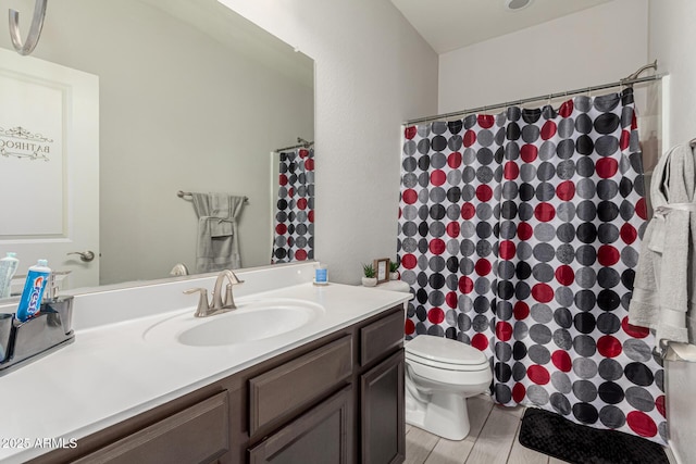 12357 W Whyman Ave, Avondale, AZ 85323 - bathroom featuring vanity, toilet, and a shower with curtain