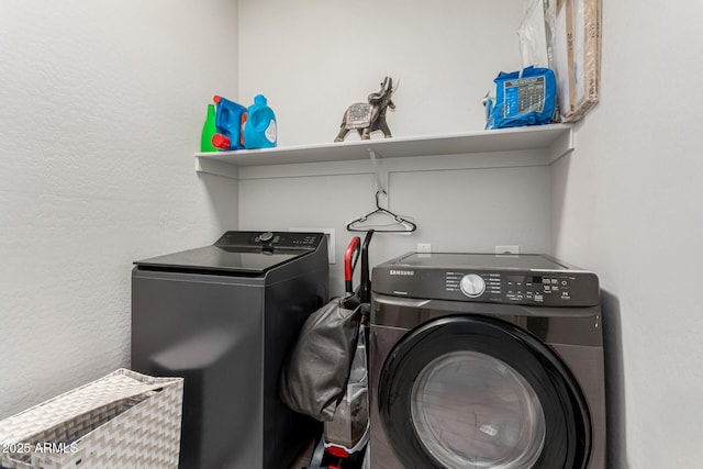 12357 W Whyman Ave, Avondale, AZ 85323 - washroom with washer and clothes dryer and a textured wall