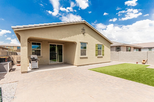 12357 W Whyman Ave, Avondale, AZ 85323 - back of house with stucco siding and a patio