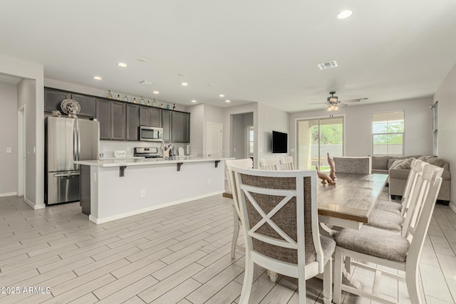 12357 W Whyman Ave, Avondale, AZ 85323 - dining space featuring recessed lighting, a ceiling fan, baseboards, and light wood finished floors