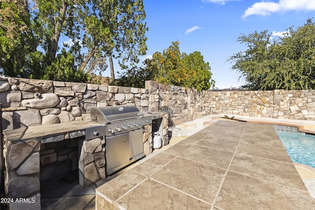 view of patio / terrace featuring exterior kitchen and area for grilling