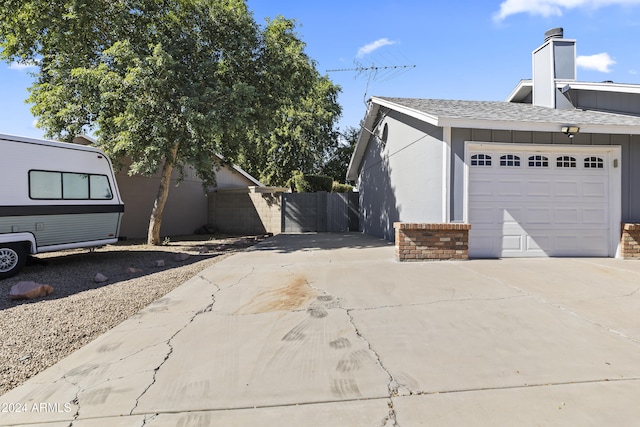 view of side of home with a garage