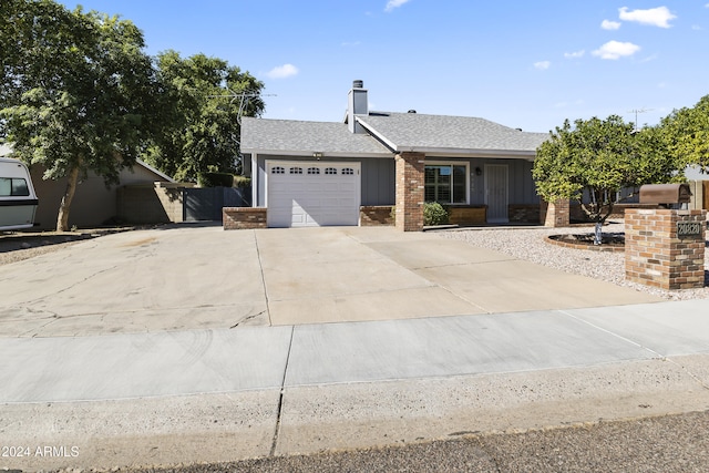 ranch-style home with a garage