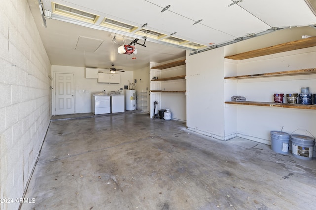 garage featuring washer and dryer, a garage door opener, and water heater