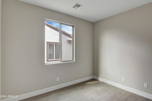 spare room with light wood-type flooring