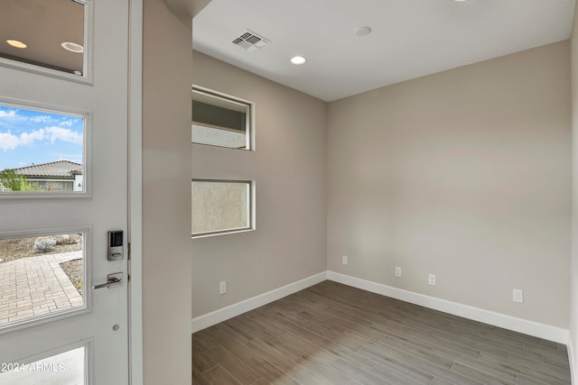 empty room featuring wood-type flooring