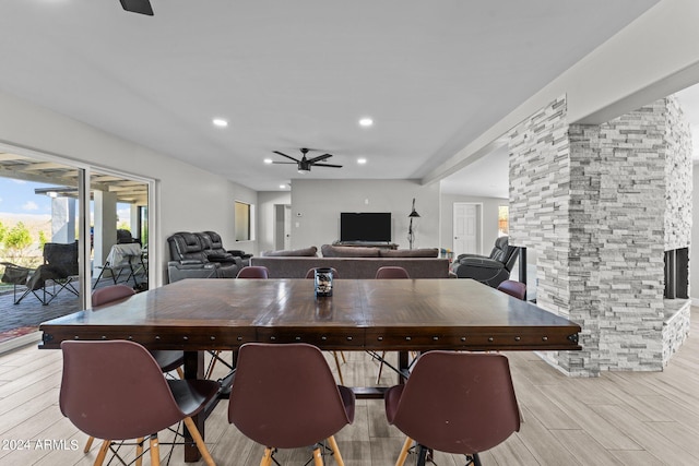 dining room featuring ceiling fan and light hardwood / wood-style floors