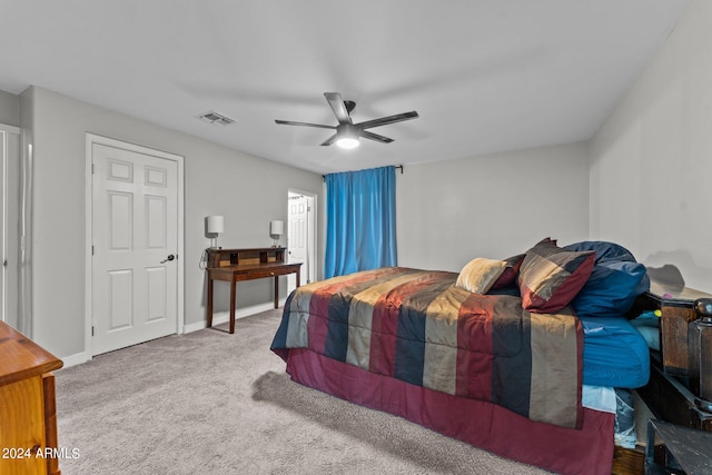 carpeted bedroom featuring ceiling fan