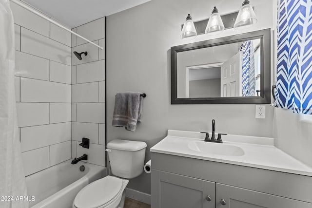 full bathroom with vanity, toilet, and tiled shower / bath