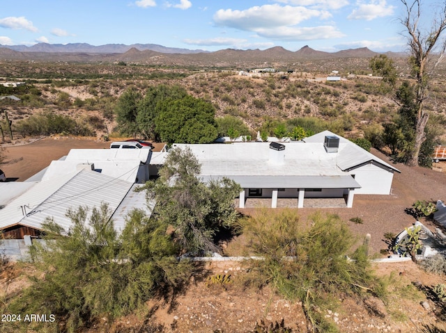 birds eye view of property featuring a mountain view