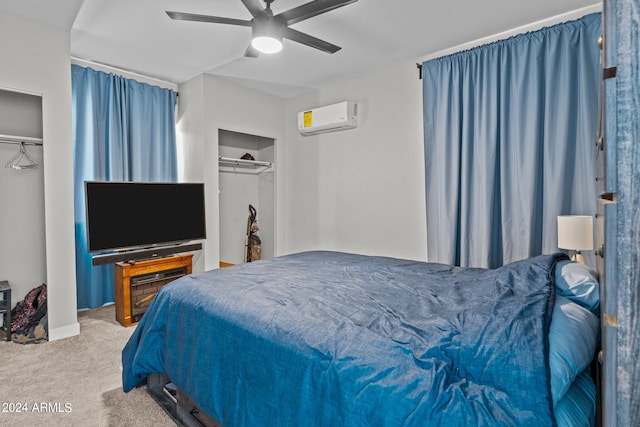 carpeted bedroom with ceiling fan and an AC wall unit