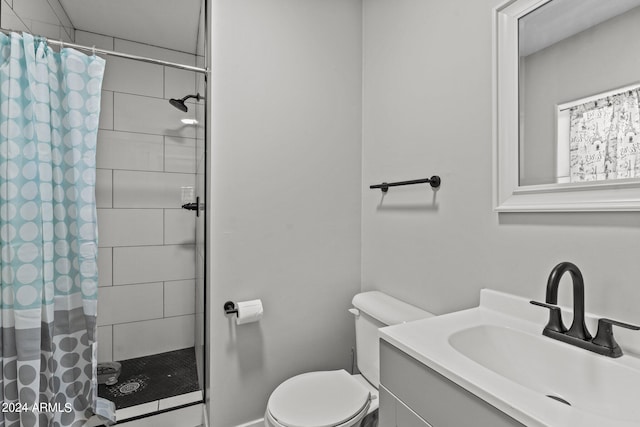 bathroom featuring walk in shower, vanity, and toilet