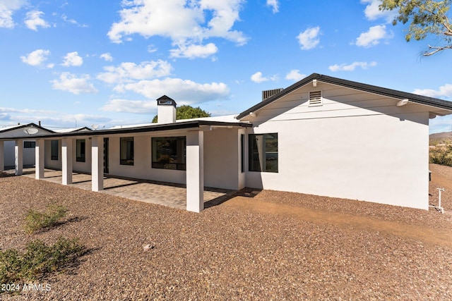 back of property featuring a patio area