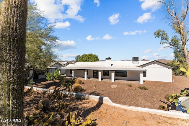 rear view of property with a patio area