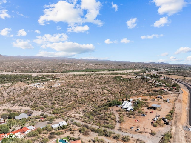 birds eye view of property featuring a mountain view