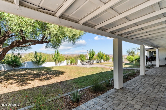 view of yard featuring a water view and a patio area