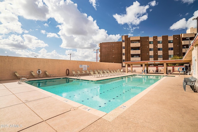 view of swimming pool with a patio