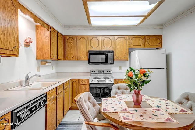 kitchen with sink and white appliances