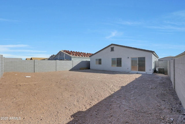 rear view of property featuring cooling unit