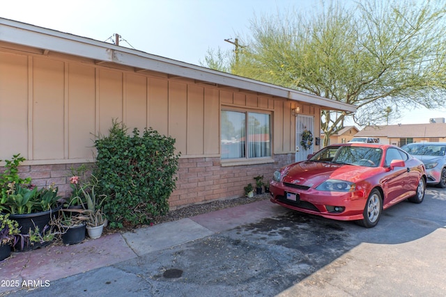 2017 E Lemon St, Tempe, AZ 85281 - view of home's exterior featuring board and batten siding and brick siding