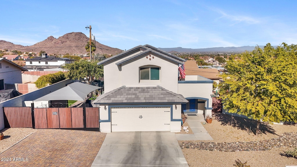 view of front of house featuring a mountain view and a garage