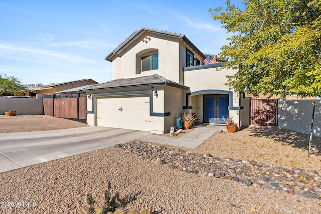 view of front of property featuring french doors and a garage