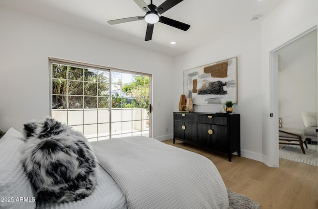 7710 E Gainey Ranch Rd E Unit 115, Scottsdale, AZ 85258 - bedroom with access to outside, wood finished floors, recessed lighting, and ceiling fan