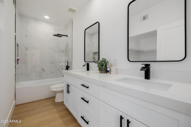 7710 E Gainey Ranch Rd E Unit 115, Scottsdale, AZ 85258 - full bathroom with double vanity, tub / shower combination, wood finished floors, and recessed lighting