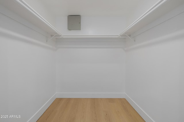7710 E Gainey Ranch Rd E Unit 115, Scottsdale, AZ 85258 - walk in closet featuring light wood-style floors