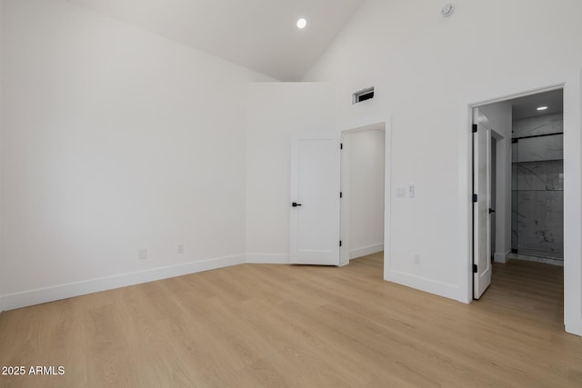 7710 E Gainey Ranch Rd E Unit 115, Scottsdale, AZ 85258 - unfurnished bedroom featuring light wood-style floors, recessed lighting, and high vaulted ceiling