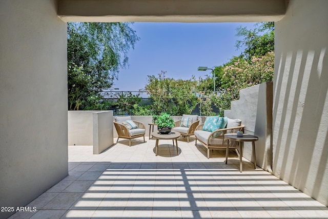 7710 E Gainey Ranch Rd E Unit 115, Scottsdale, AZ 85258 - view of patio / terrace featuring an outdoor living space