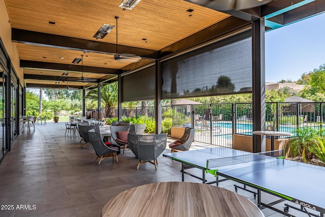 7710 E Gainey Ranch Rd E Unit 115, Scottsdale, AZ 85258 - view of patio / terrace featuring outdoor dining space and ceiling fan
