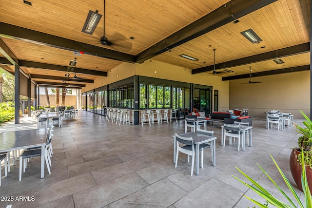 7710 E Gainey Ranch Rd E Unit 115, Scottsdale, AZ 85258 - view of patio featuring outdoor dining space, ceiling fan, and outdoor lounge area