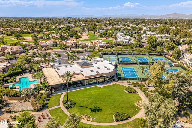 7710 E Gainey Ranch Rd E Unit 115, Scottsdale, AZ 85258 - drone / aerial view of a mountain backdrop and a pool
