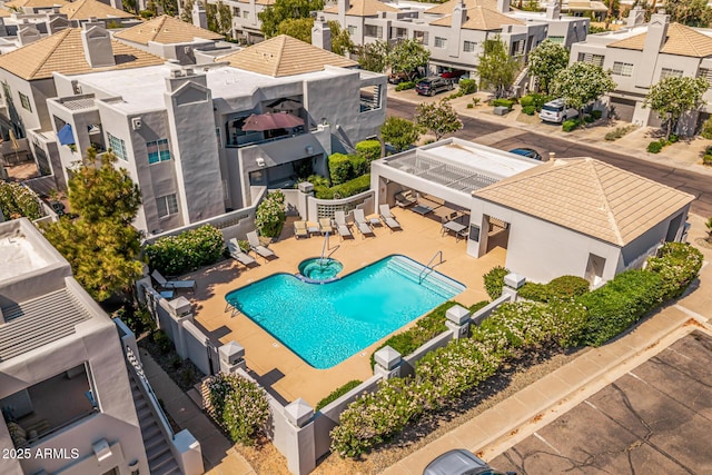 7710 E Gainey Ranch Rd E Unit 115, Scottsdale, AZ 85258 - aerial perspective of suburban area with a pool