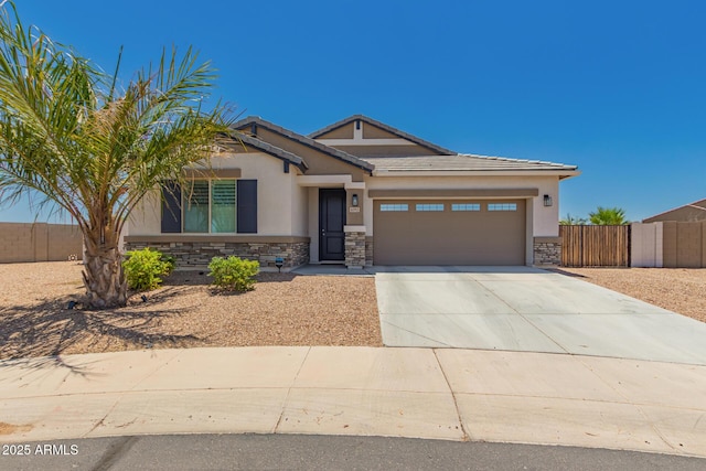 40913 W Williams Way, Maricopa, AZ 85138 - view of front of property featuring stone siding, stucco siding, an attached garage, driveway, and a tile roof