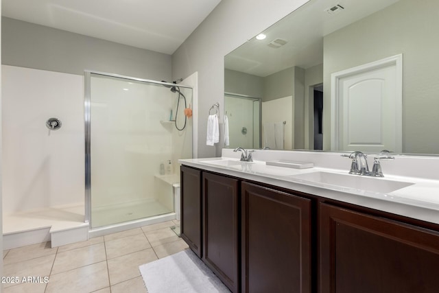 40913 W Williams Way, Maricopa, AZ 85138 - bathroom featuring a walk in shower, double vanity, and tile patterned flooring