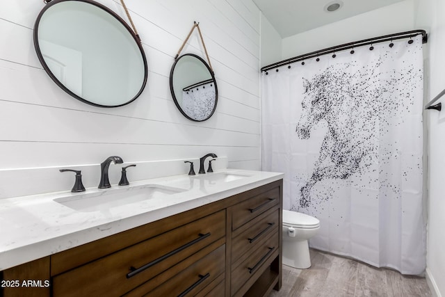 40913 W Williams Way, Maricopa, AZ 85138 - full bathroom featuring double vanity, wood finished floors, wood walls, and a shower with shower curtain