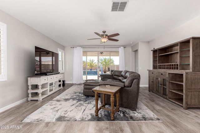 40913 W Williams Way, Maricopa, AZ 85138 - living area with wood finished floors and a ceiling fan