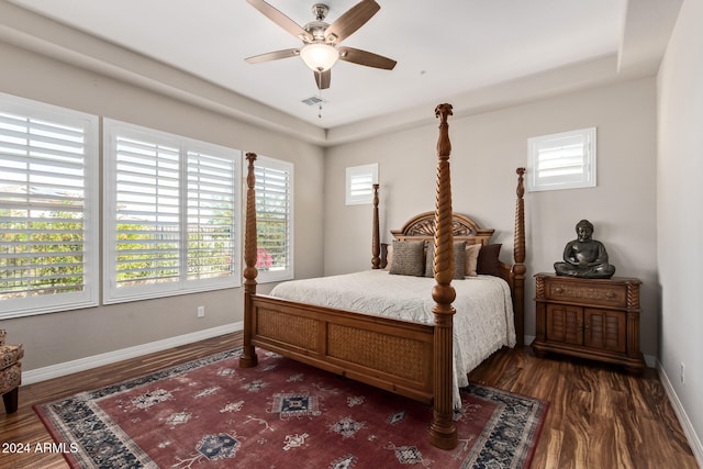 bedroom featuring ceiling fan and dark hardwood / wood-style floors