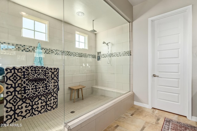 bathroom featuring tiled shower