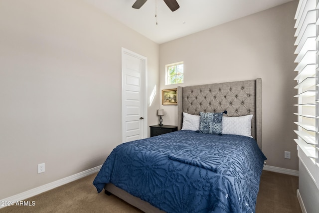 bedroom with ceiling fan and carpet floors